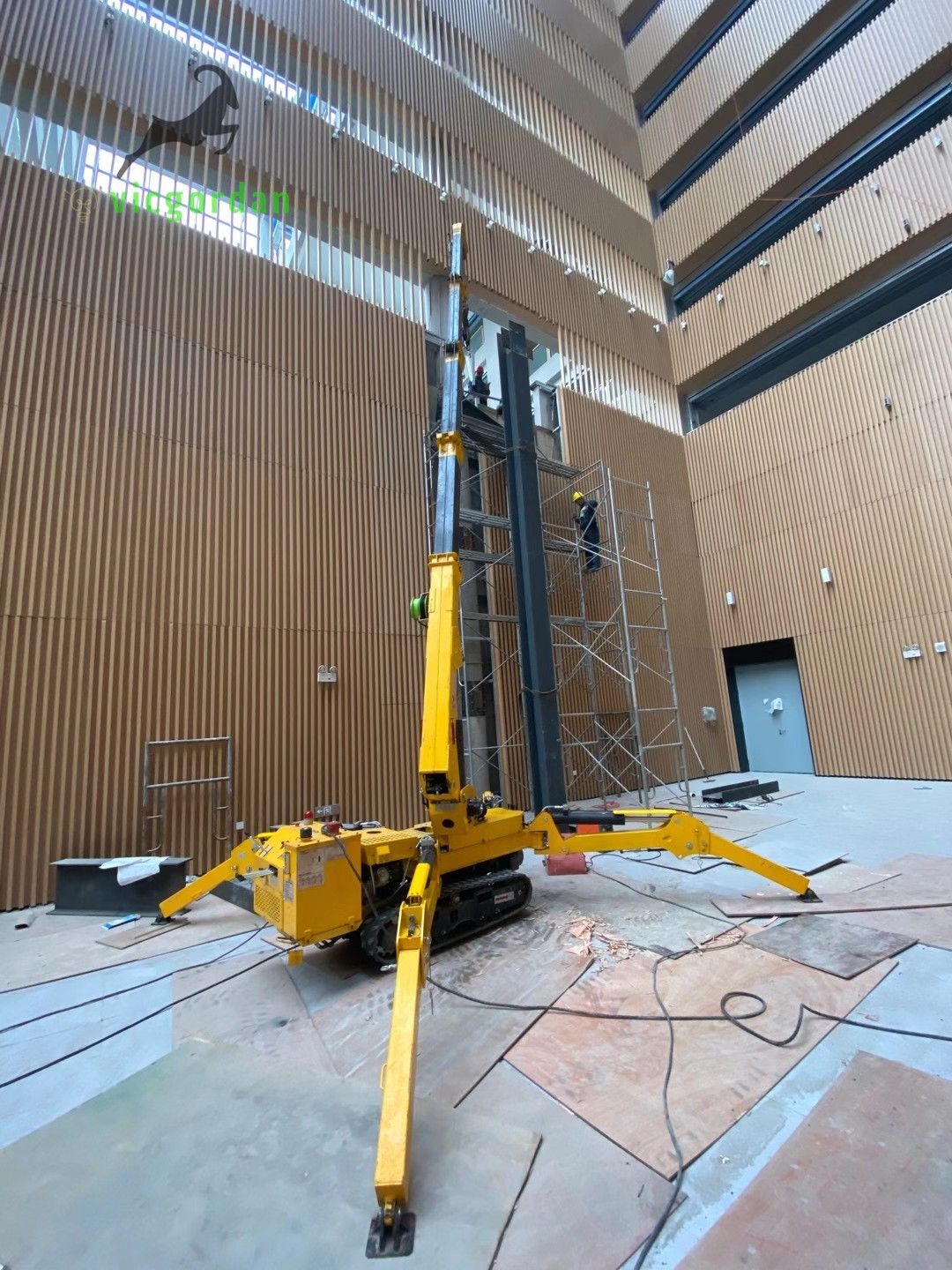 2 units Vicgordan spider cranes VSC195 are working on the inside of library.